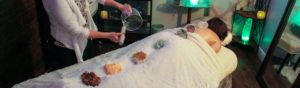 Sound healing and chakra crystals on a spa table