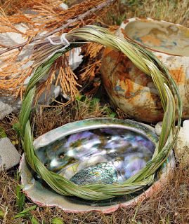 A braided bundle of sweet grass and abalone shell