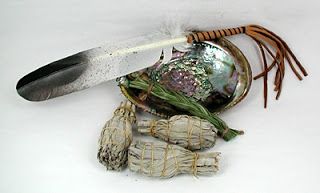 A simple smudge kit with white sage and sweet grass