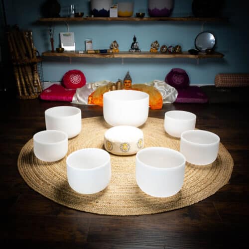 7 quartz crystal singing bowl chakra set with zafu at theom shoppe and spa sarasoa florida