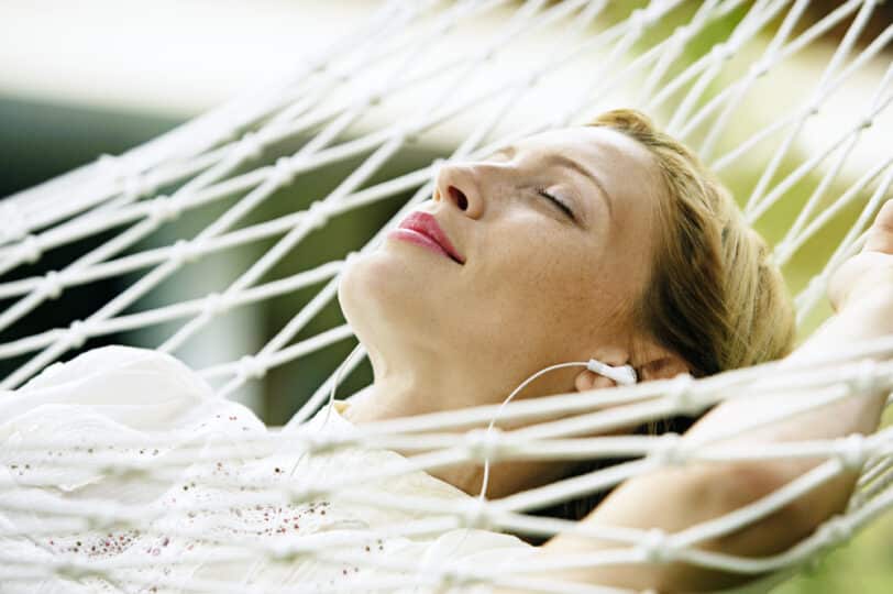 relaxing with headphones on hammock