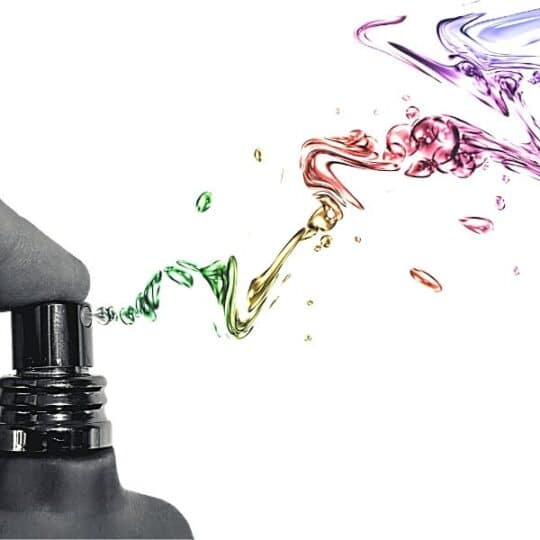 Colorful spary being sprayed from a bottle how to make gem elixirs and clearing sprays blog the om shoppe